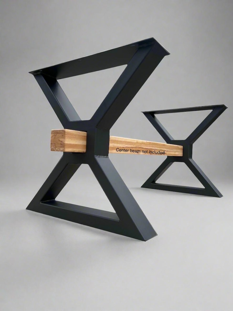 May include: Black metal table legs with a triangular design. The legs are connected by a wooden beam. "Center beam not included" is written on the beam.