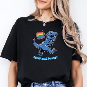 Loud and Proud T-Rex T-Shirt - LGBTQ Pride Dinosaur Tee - Rainbow Flag Equality Shirt Gay Lesbian Bisexual Trans Non-Binary Queer Ally Gift