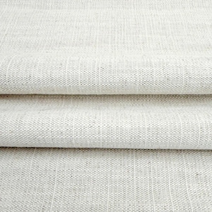 May include: A light beige fabric with a visible woven texture and subtle vertical stripes. The material features a dense, uniform weave pattern with light and dark neutral fibers creating a consistent, textured surface across the entire piece.
