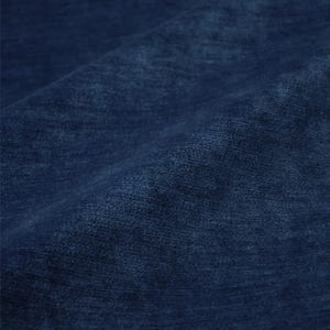 May include: A deep navy blue fabric with a soft, velvety texture. The material features a subtle, directional nap that creates variations in light and shadow across the surface, highlighting the dense, plush pile of the textile material.