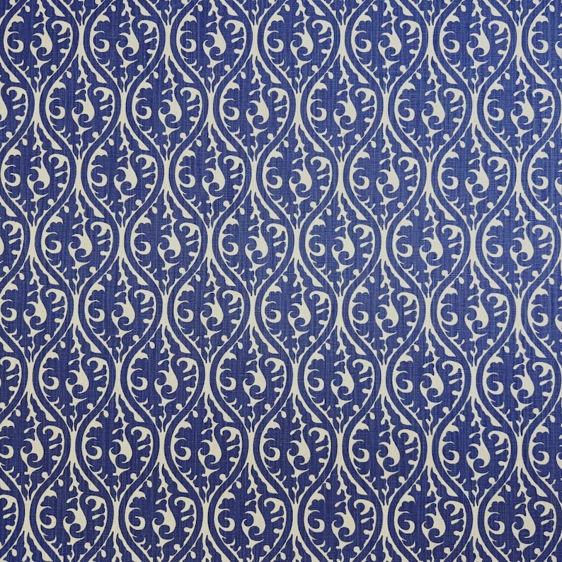 a repeating pattern of blue and white swirls and leaves, creating a visually striking and intricate design.