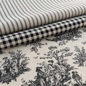 May include: Three layers of fabric stacked together. The top layer features a black and white ticking stripe pattern. The middle layer displays a black and white gingham check pattern. The bottom layer shows a black and white toile print.