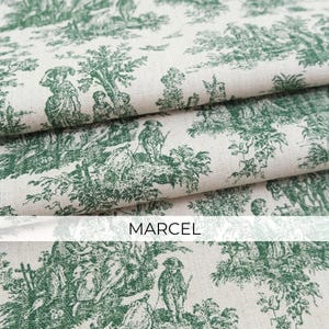 May include: A folded piece of off-white fabric featuring a repeating dark green toile pattern of figures in a landscape with trees and foliage. The word MARCEL is printed in a simple black sans-serif font across the center of the image.