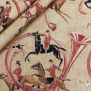 May include: Tan fabric with a repeating pattern of riders on horseback, hunting horns, and hounds in red, brown, and black. The fabric has a vintage, equestrian theme.