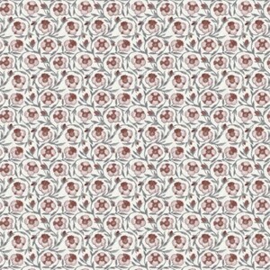 Muted red drapery textile with vintage floral pattern in dusty rose and maroon suitable for stylish home decor and upholstery