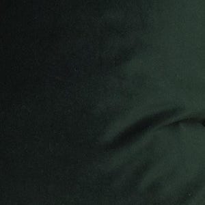 May include: A solid dark forest green fabric with a soft, matte, and slightly fuzzy texture. The material displays subtle folds and natural draping, creating gentle shadows across the surface that highlight the deep, uniform color of the textile.
