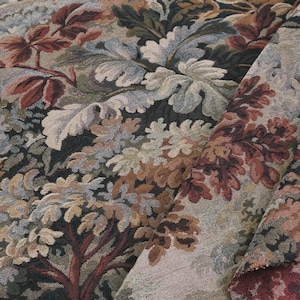 Close-up of verdure foliage tapestry upholstery fabric in Woodrose tones showing scenic woven leaves and branches, heavyweight jacquard material ideal for sofa upholstery, chair covers, antique style drapery, slipcovers, pillows, and vintage decorative home textiles.
