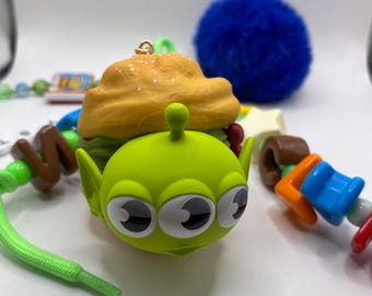 Alien Toy Story bag charm with blue Pom Pom