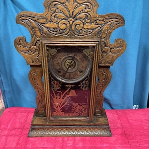 May include: A white ceramic mug with a black handle and the text "But First, Coffee" in a bold, black font. The mug is set against a blurred background, suggesting a cozy setting. The mug appears to be approximately 4 inches tall.
