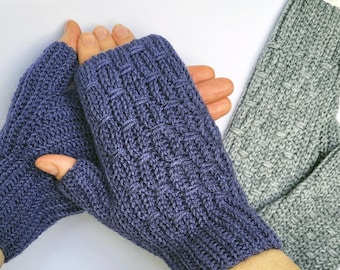 May include: A pair of fingerless gloves in a dark blue colour with a textured knit pattern. The gloves are made of a soft, warm material and are perfect for keeping your hands warm in the winter.