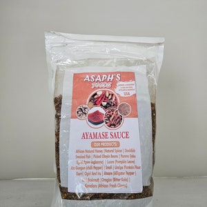 May include: A white resealable bag filled with a blend of spices and herbs. The bag has a label that reads "Asaph's Foods Ayamasa Sauce" and lists the ingredients: African Natural Honey, Natural Spices, Stockfish, Smoked Fish, Picked Oloyin Beans, Ponmo ljebu, Egusi Apon (ogbonna), Luure (Pumpkin Leave), Ata Gungun (chilli Pepper), Snail, Unripe Plantain Flour, Garri, Ogiri And Iru, Ataare (Alligator Pepper), Chi (kolanut), Orogbo (Bitter Kola), Kanafaru (African Fresh Cloves).