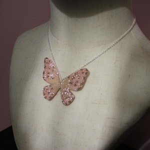 Peach butterfly necklace cheetah print