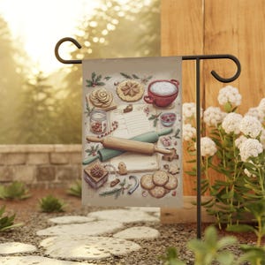 May include: A beige garden flag featuring a watercolor illustration of baking supplies and cookies. The image includes rolling pins, a measuring cup, a jar of nuts, and various cookie shapes, perfect for a kitchen or holiday theme.