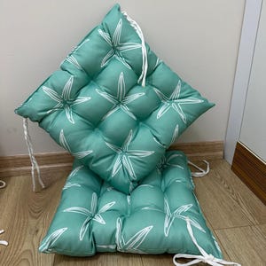 a chair made out of a cushion on the floor