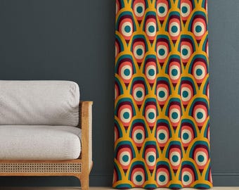 May include: A curtain featuring a repeating geometric pattern of nested arches in mustard yellow, teal, dark blue, and coral pink. The design consists of concentric shapes that create a rhythmic, layered effect across the entire fabric surface.