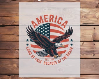 May include: A DTF transfer design featuring a patriotic theme. The design includes an American flag, an eagle with outstretched wings, and the text "AMERICA, Land of Free Because of the Brave, Est. 1776". The words "Ready To Press" and "DTF Transfer" are also included.