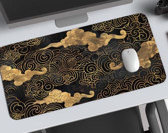 May include: A rectangular mousepad with a black background and a gold cloud and swirl pattern. A white computer mouse sits on the pad. The design has an Asian-inspired aesthetic.