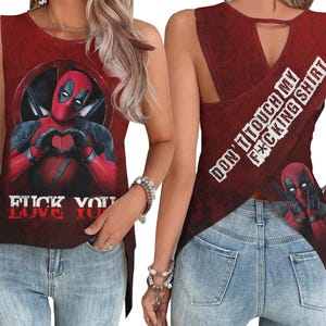 May include: Red tank top featuring Deadpool making a heart shape with his hands. The shirt has the text "FUCK YOU LOVE YOU" at the bottom. The back of the shirt has the text "DON'T TOUCH MY F*CKING SHIRT".