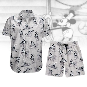 May include: A grey and white button-up shirt and matching shorts with a repeating pattern of Mickey Mouse in a sailor outfit. The Mickey Mouse figures are in black and white with red accents.