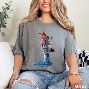 May include: A set of three ceramic mugs with a speckled, matte finish in cream, light grey, and dark grey. Each mug has a minimalist design, ideal for coffee or tea.