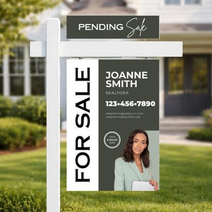 May include: A white real estate sign with the words "FOR SALE" in large, bold, black letters. The sign also displays "PENDING Sale" and information for Joanne Smith, Realtor, including a photo and contact details.