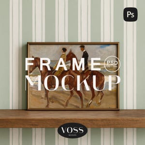 May include: A framed art print featuring a vintage painting of two people riding horses on a beach. The artwork is in a gold frame and rests on a wooden shelf. The words "FRAME MOCKUP" are overlaid on the image.