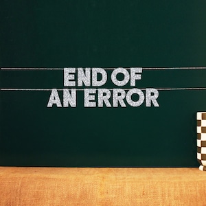 May include: A silver glitter banner with the text "END OF AN ERROR" hanging on a green chalkboard.