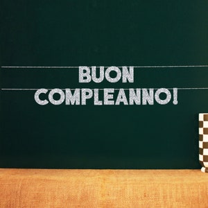 May include: A green chalkboard with the words "BUON COMPLEANNO!" written in silver glitter letters.