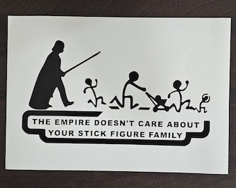 May include: Black and white sticker featuring a silhouette of Darth Vader with a lightsaber, chasing stick figures. The text reads "THE EMPIRE DOESN'T CARE ABOUT YOUR STICK FIGURE FAMILY."