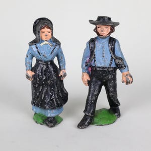 Amish couple cast iron vintage figurines hand-painted about 5 inches tall each