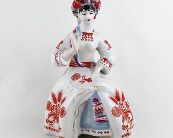 Ukrainian porcelain figurine girl stitching embroidery on folk wedding towel marked 9.5 inches tall