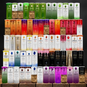 May include: A collection of 48 colorful aluminum cans of Ciroc vodka, arranged in five rows of ten cans each. The cans feature various flavors, including Apple, Summer Citrus, Peach, Mango, Red Berry, and Black Raspberry.