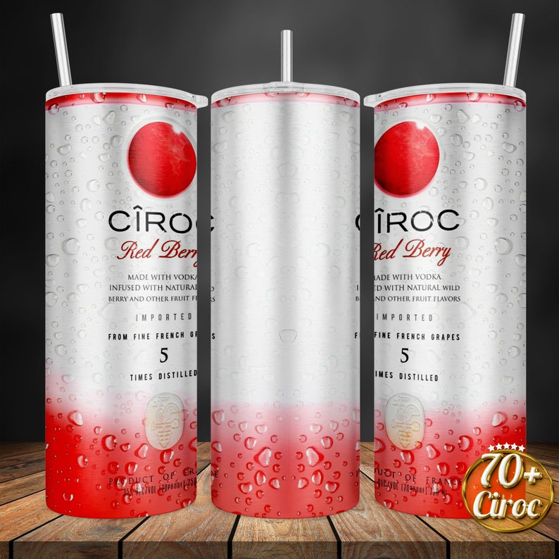 May include: A stainless steel tumbler with a red berry design and the text "C&Icirc;ROC Red Berry" and "Made with Vodka Infused with Natural Berry and Other Fruit Flavors Imported From Fine French Grapes 5 Times Distilled".