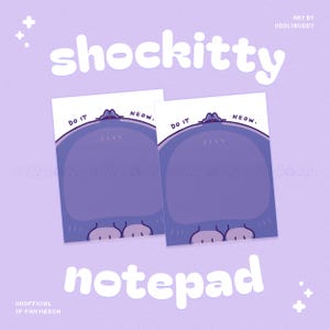 Może przedstawiać: Dwa fioletowe notatniki z motywem kota z kreskówki. Napisy "shockitty" i "notepad" są wyświetlane na biało. Każdy notatnik zawiera tekst "DO IT" i "NEOW."
