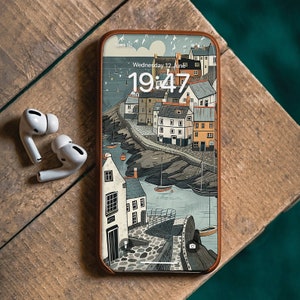 May include: A brown leather phone case featuring a colourful illustration of a seaside town. The phone case displays a digital clock showing "19:47" and the text "Wednesday 12 June".