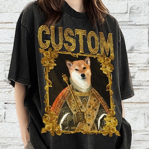 May include: Black oversized t-shirt featuring a vintage-style print of a Shiba Inu dog wearing a crown and robe. The text "CUSTOM" is printed above the image.