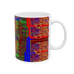 May include: White ceramic mug with a colorful circuit board design. The design features red, blue, green, and yellow lines and shapes.