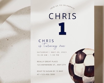 May include: A white and blue birthday invitation for a boy turning one. The invitation features a soccer ball graphic and the text "JOIN US TO CELEBRATE CHRIS 1 CHRIS is turning one SATURDAY MAY 20, 2023 10.30 AM - 1.30 PM REALLY GREAT PLACE 123 ANYWHERE ST., ANY CITY RSVP TO SUSAN BY 15 MAY AT +123-456-7890"