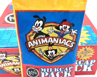 Paquete de tapas de leche selladas de fábrica Animaniacs de la Federación Mundial de POG NOS