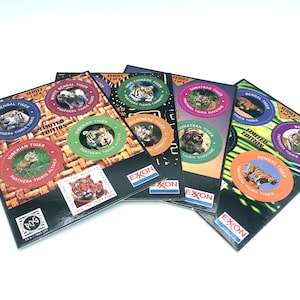 May include: A set of six limited edition tiger trading cards featuring different tiger subspecies. Each card has a colorful design with a photo of a tiger and the words "Limited Edition" printed on it. The cards are from the Exxon "Save the Tiger Fund" series.