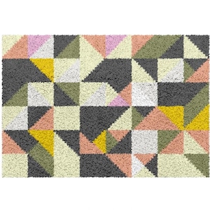 May include: A geometric patterned rug featuring a range of colours, including pink, yellow, green, and grey. The rug is made from a soft, fluffy material.