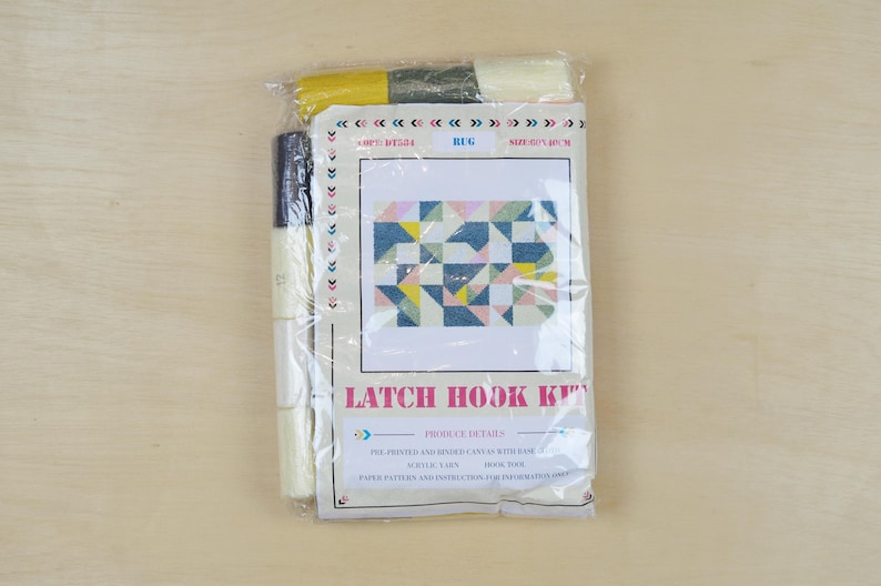 May include: A latch hook kit featuring a colourful geometric pattern. The kit includes yarn, a canvas, and instructions. Latch Hook Kit.