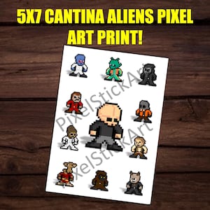 May include: A white print featuring pixel art of various alien characters. The print includes the text "5x7 Cantina Aliens Pixel Art Print!" in yellow. The artwork is displayed on a wooden background.