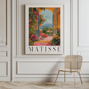 May include: A vintage poster featuring a painting by Henri Matisse. The poster depicts a colorful scene of a patio with an open doorway leading to a view of the sea. The text "MATISSE" is printed in bold letters at the bottom of the poster.
