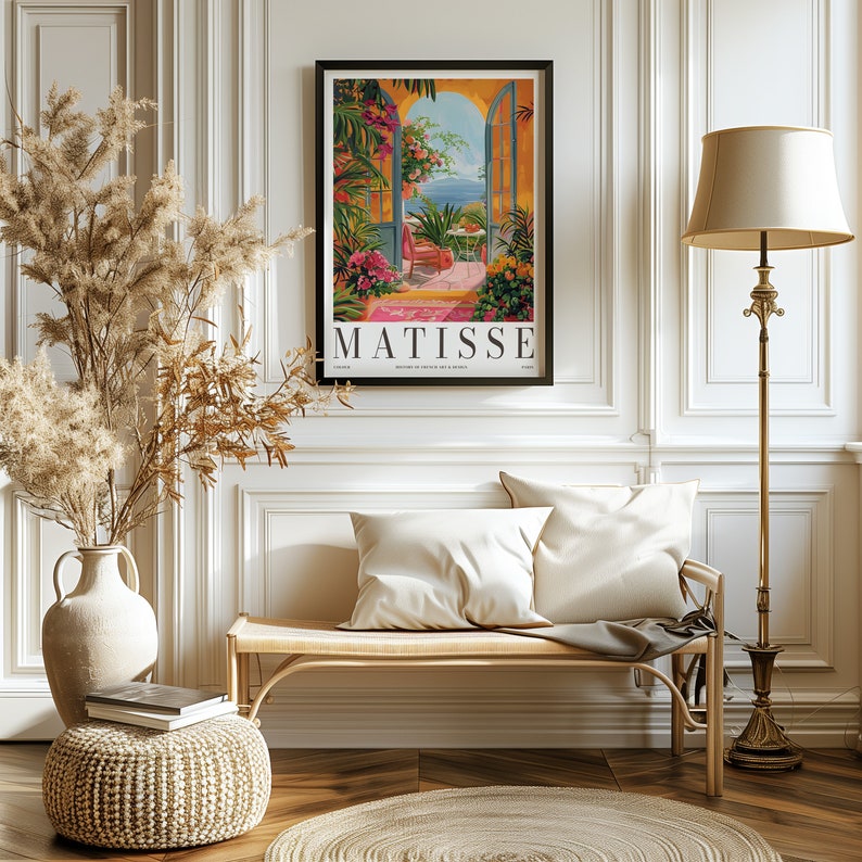 May include: A vintage poster featuring a painting by Henri Matisse. The poster depicts a colorful scene of a doorway opening to a view of a blue sea and sky. The text "MATISSE" is printed in bold letters at the bottom of the poster.