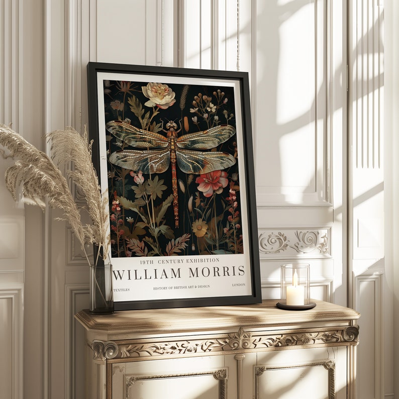 May include: A black framed poster with a vintage illustration of a dragonfly surrounded by flowers. The poster reads "19th Century Exhibition William Morris Textiles History of British Art & Design London".