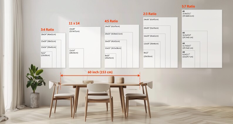 May include: A white wall with a variety of different sized rectangular frames, each with a different aspect ratio, labeled with the ratio and measurements in inches and centimeters. The frames are arranged in a row from left to right, with the largest frame on the right. The frames are all white and have a simple, modern design. The wall is painted a light gray color. A wooden table with four chairs is in front of the wall. The table is made of light wood and has a simple, modern design. The chairs are also made of light wood and have a simple, modern design. The chairs are all facing the table. The table and chairs are in a room with a light gray floor. The room is well-lit and has a modern, minimalist design.