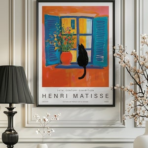 May include: A vintage poster featuring a painting by Henri Matisse. The painting depicts a black cat sitting on a windowsill with a vase of flowers. The poster is titled "20th Century Exhibition Henri Matisse" and includes the text "Colour, History of French Art & Design, Paris".