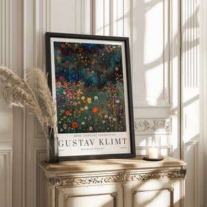 May include: A black framed poster with a colorful painting of flowers and a dark blue background. The poster reads "20th Century Exhibition" and "Gustav Klimt" in white text.