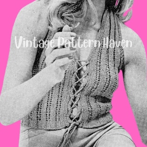 May include: A crochet halter top with a lace-up front. The top is made of a textured yarn and has a relaxed fit.